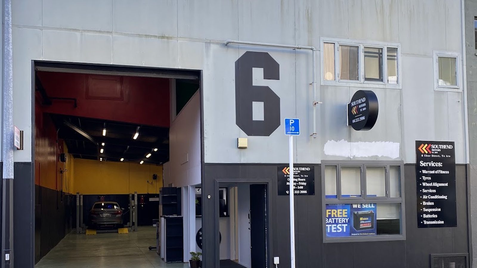 South End Motors Te Aro shopfront at 6 Ebor Street, with the roller door open onto the workshop